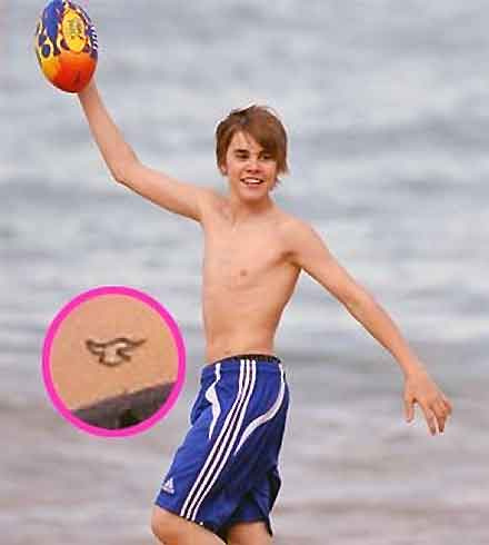 Justin Bieber with bird tattooed on his left hip
