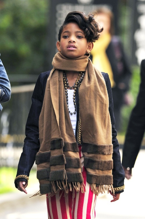 46351, NEW YORK, NEW YORK - Tuesday October 19, 2010. Willow Smith struts down the street as she leaves her hotel in NYC with a helper holding onto her dog. Photograph:  PacificCoastNews.com