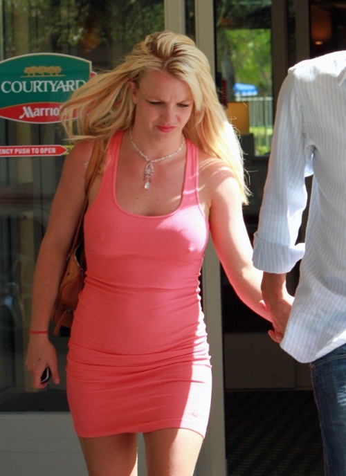Singer Britney Spears had quite the sour expression as she held hands with boyfriend Jason Trawick, who is rumored to have cheated on Britney with a former assistant, while entering the Courtyard Marriott Hotel in Calabasas, CA on June 11, 2010.  Fame Pictures, Inc
