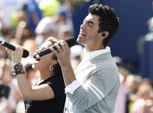 Demi Lovato and Joe Jonas of the The Jonas Brothers perform a duet during Arthur Ashe Kids' Day at the US Open held at the National Tennis Center on August 28, 2023 in New York.   UPI /Monika Graff... Photo via Newscom